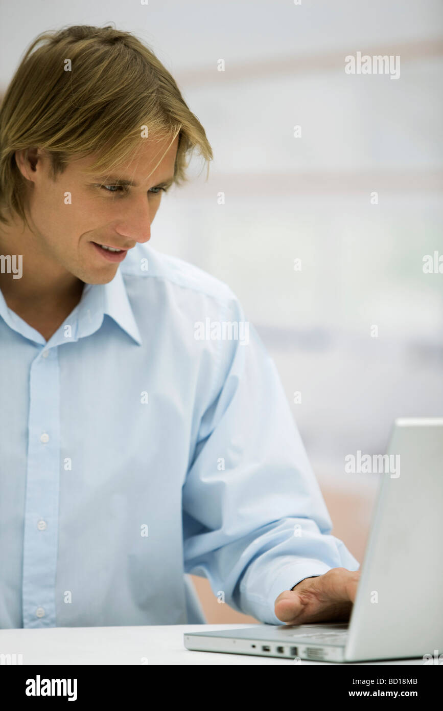 Man using laptop computer Stock Photo - Alamy