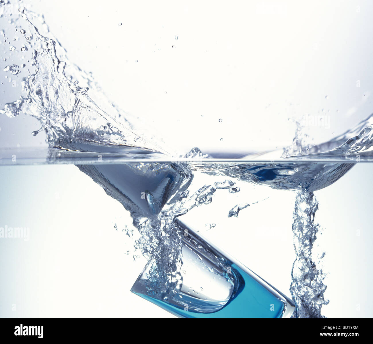 Glass dropped in water white background Stock Photo Alamy