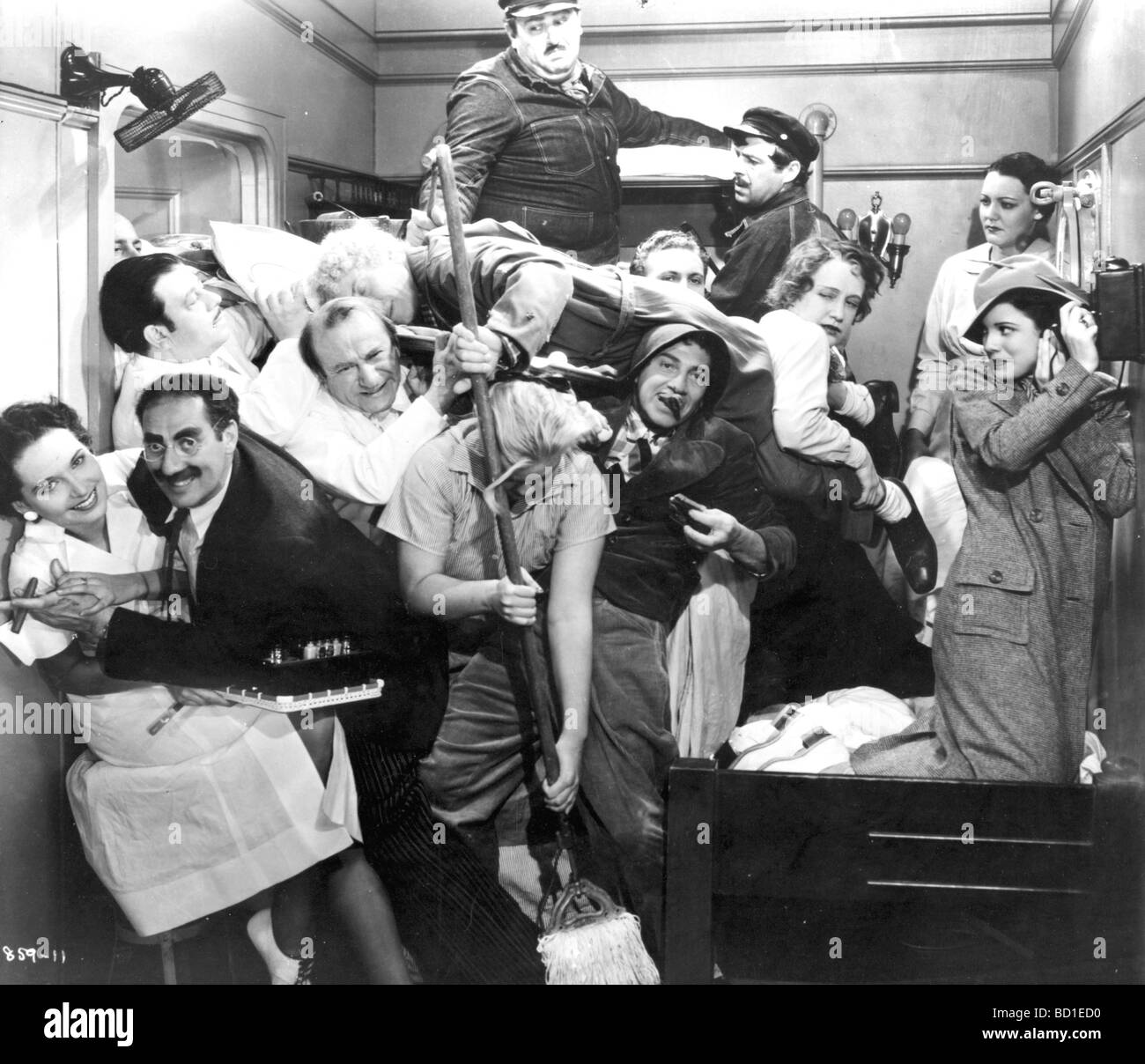 MARX BROTHERS Groucho at left enjoys the crowded lift Stock Photo