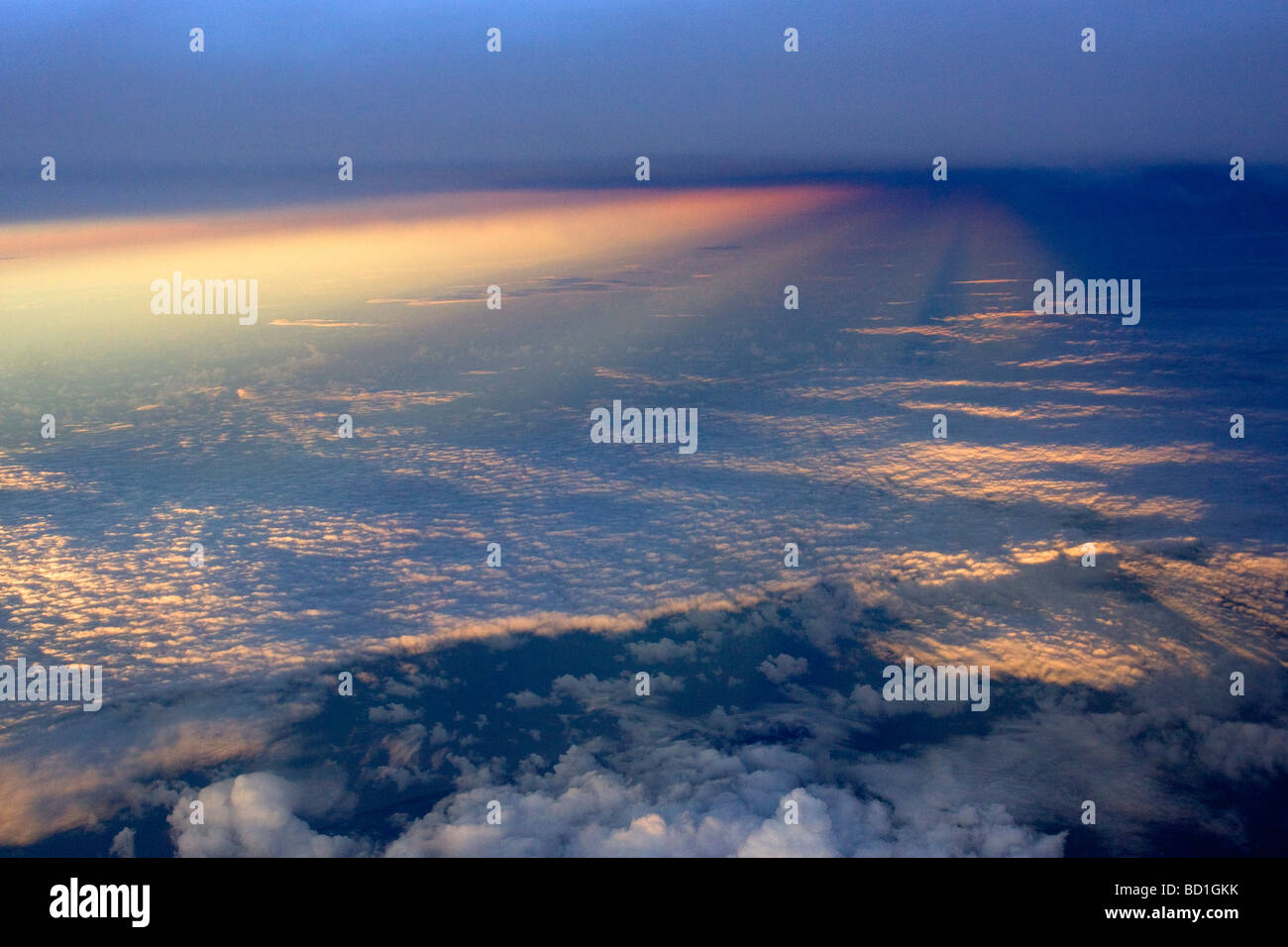 Sunrise sunbeam aeroplane window sun's sun ray cloud Stock Photo