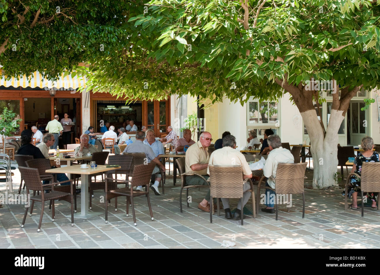 Local people sitting at outdoor cafe in Chania Crete Greece  Stock Photo