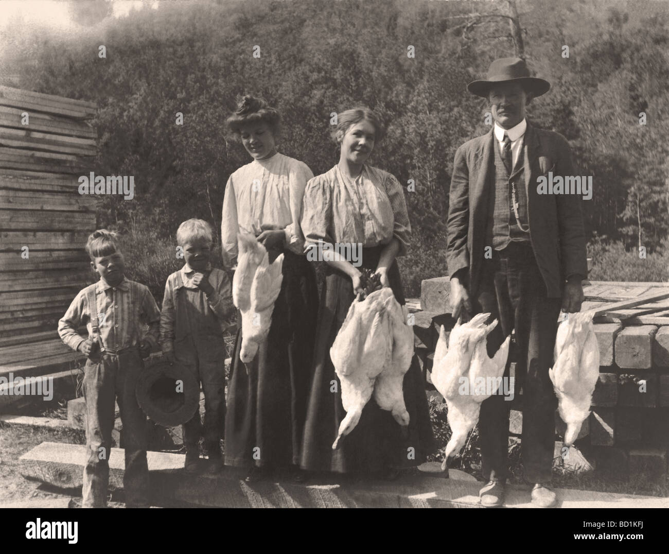 Family of Five Holding Five Ducks Stock Photo