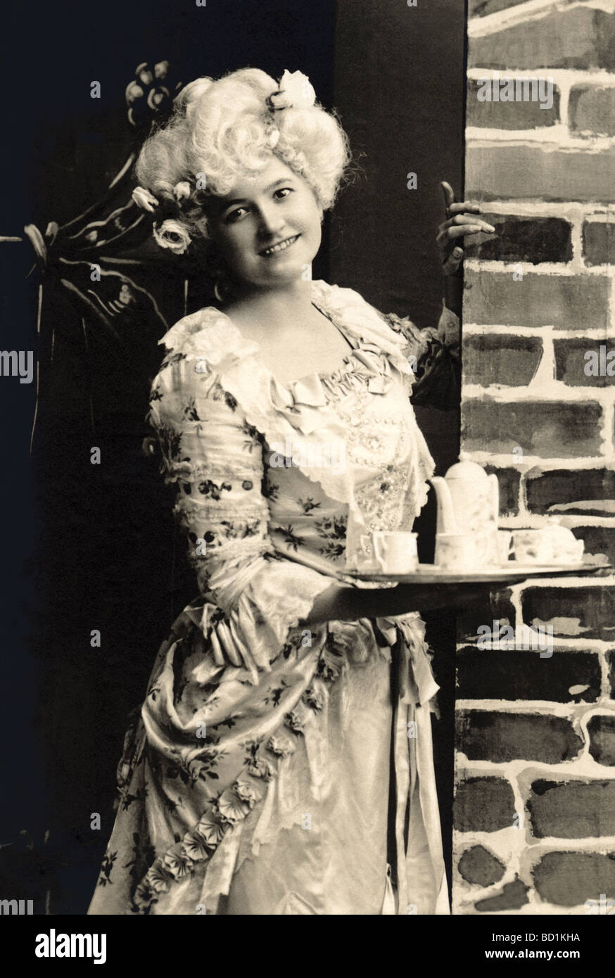 Elegant Waitress in 18th Century Fashions Stock Photo