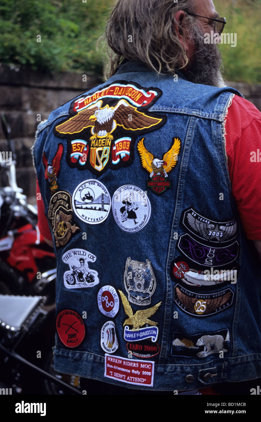 Biker With Numerous Badges Sewn Onto Denim Jacket Stock Photo - Alamy