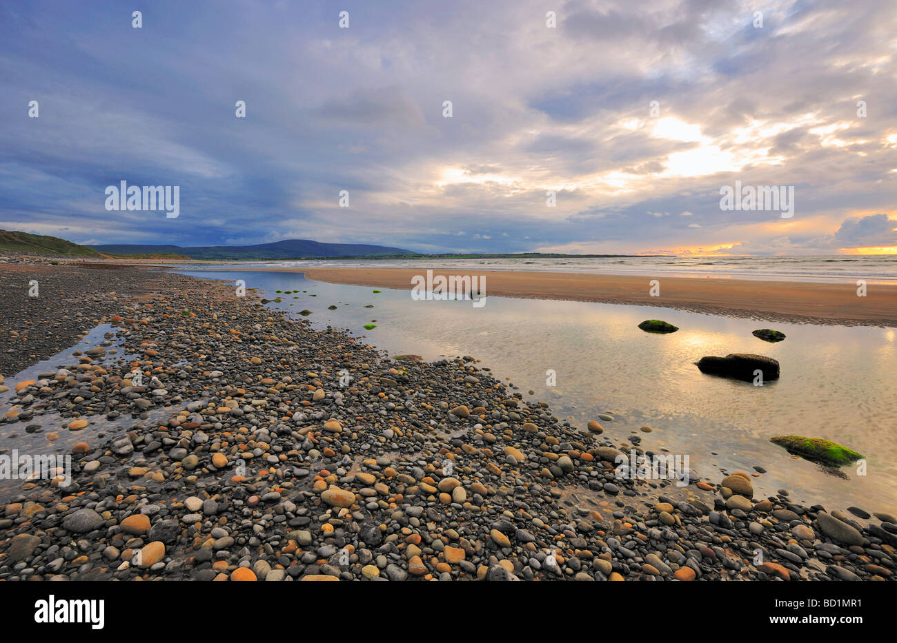 evening light illuminates beach and shoreline at Strandhill Co Sligo