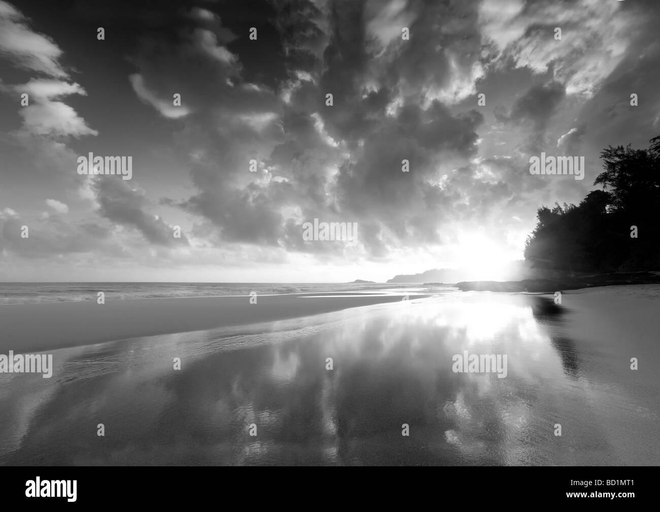 Sunrise at low tide at Secret Beach Kauai Hawaii Stock Photo