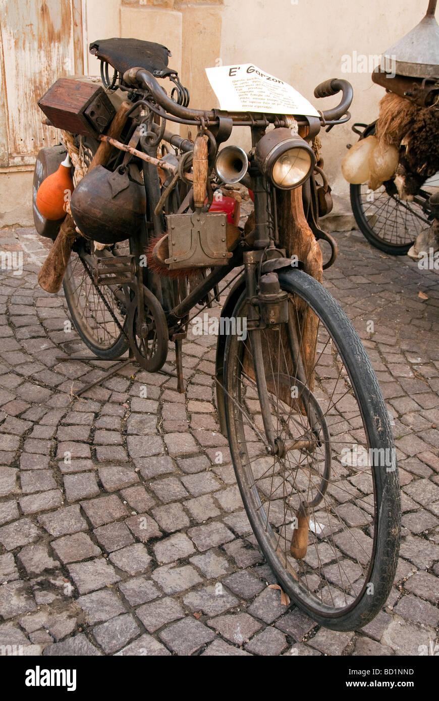 Vintage tinkers bicycle on display at a festival of old traditions in Sansepolcro Tuscany Stock Photo
