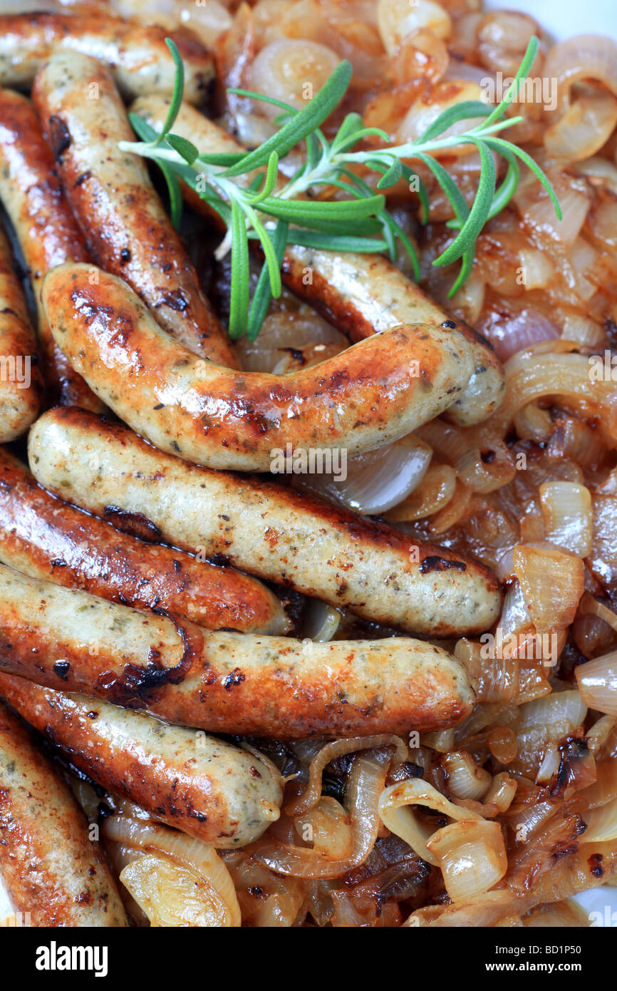 Close up of fried English or German style sausages and fried onions