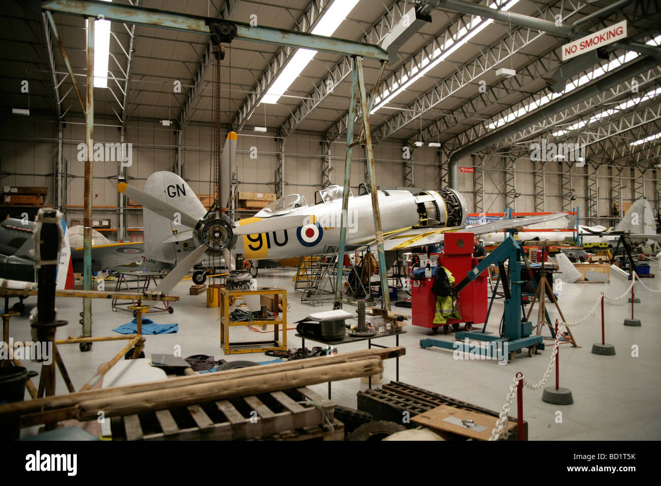 Historic plane being restored in a hanger by engineer,away from the elements Stock Photo