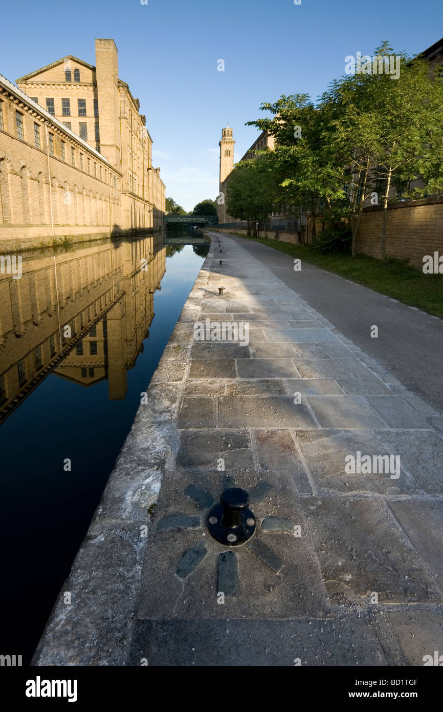 A view of Salts Mill and the Leeds Liverpool Canal at Saltaire, a UNESCO world heritage site in Bradford West Yorkshire Stock Photo