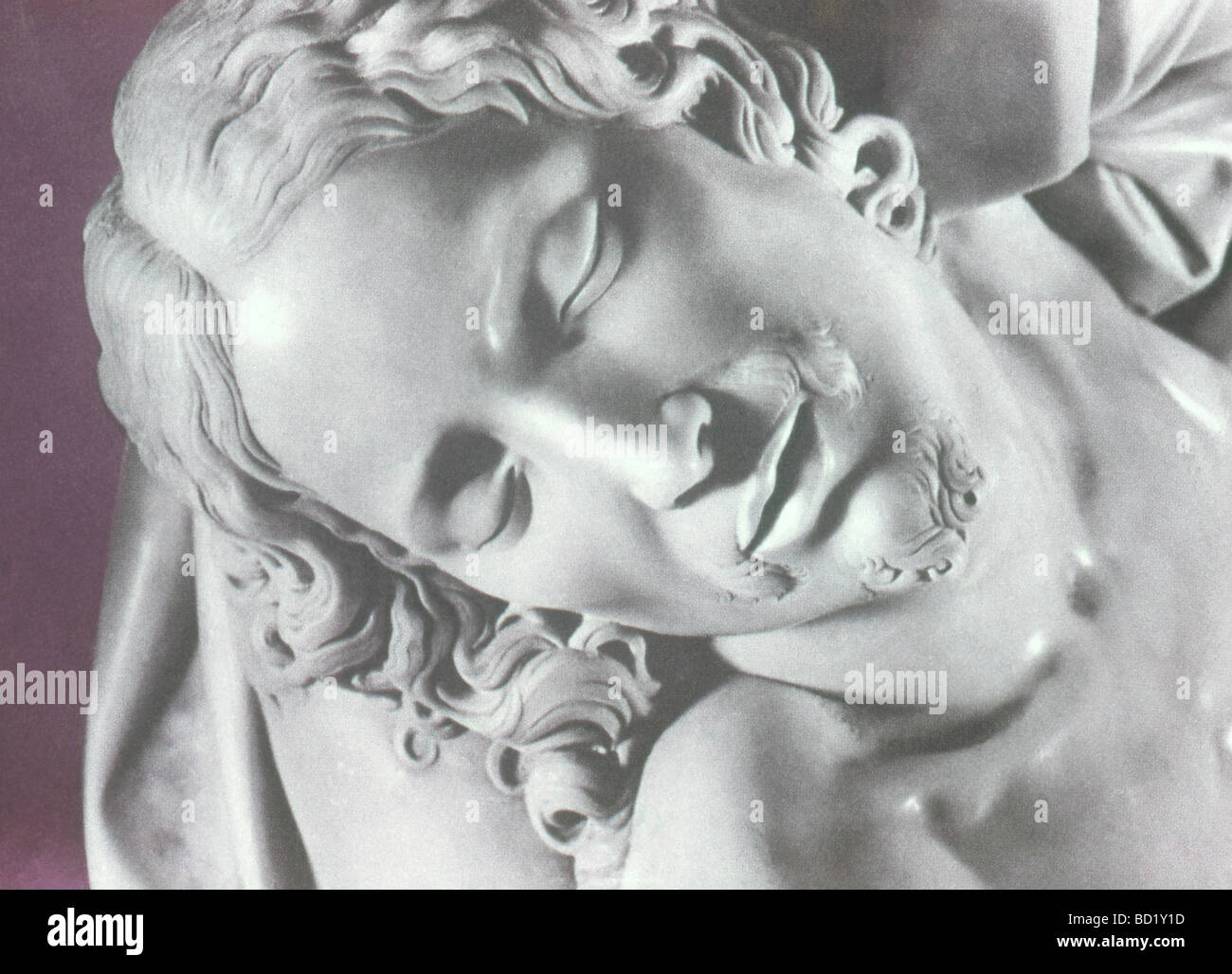 This section of the sculpture by Michelangel titled Pieta shows a close up of the face Jesus Christ. Stock Photo