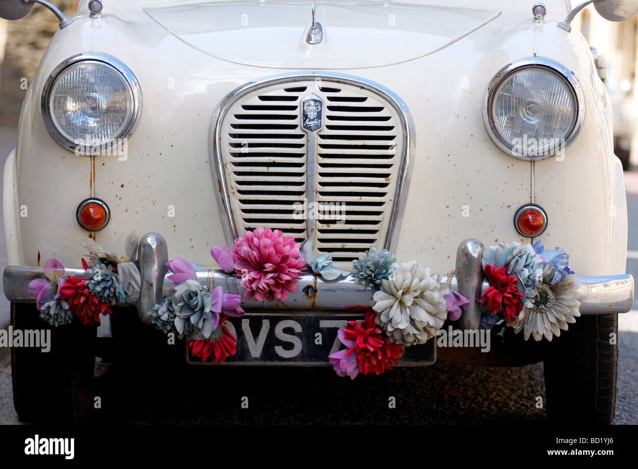 Old Austin A30 car with flowers on its bumper Stock Photo