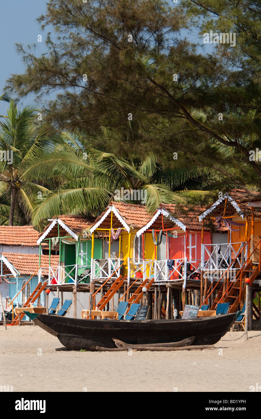 Cocohut beach holiday bungalows on stilts Agonda beach Goa India Stock Photo
