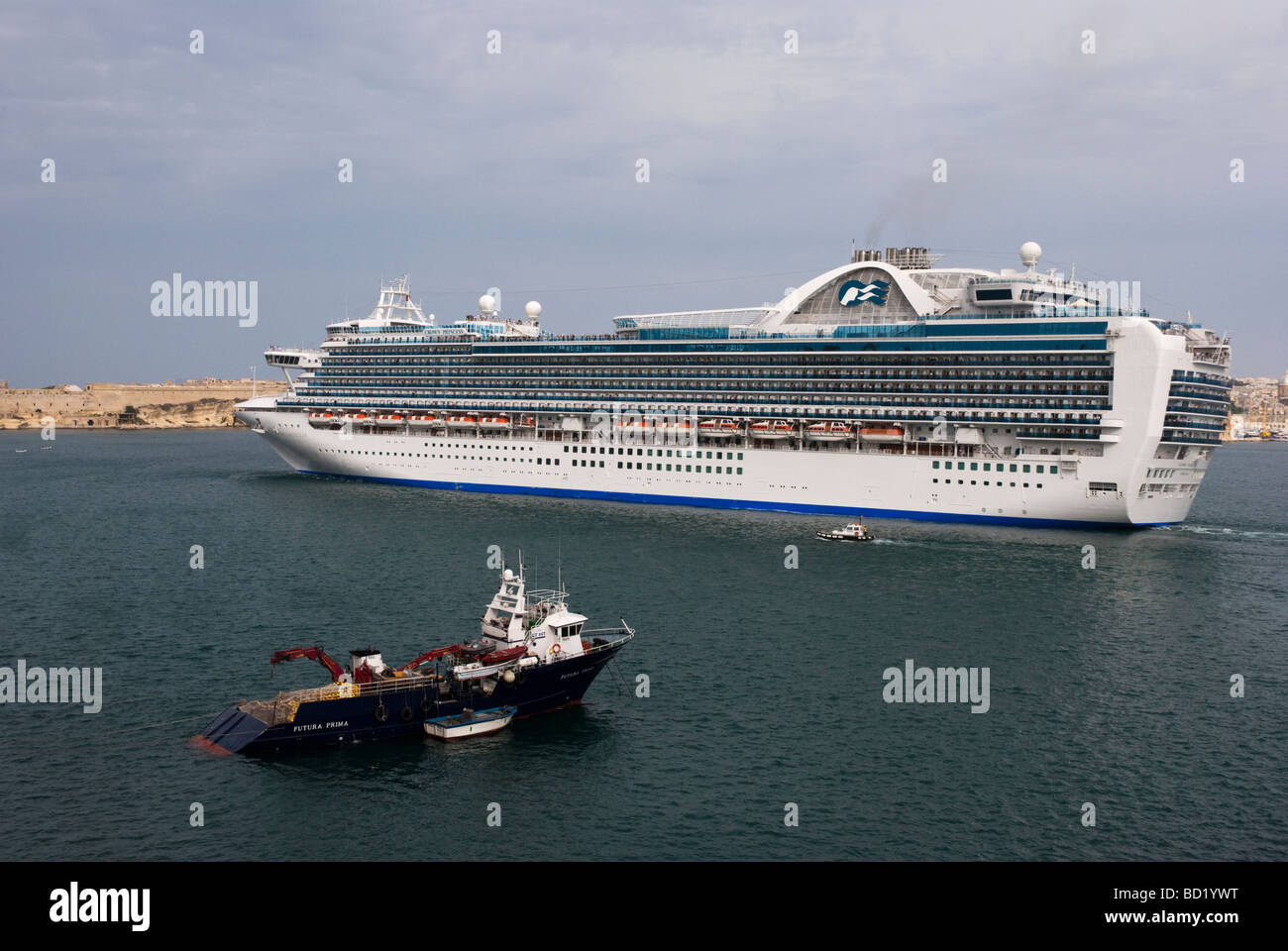 The cruise liner The Crown Princess sailing out of the Grand Harbour, Valletta, Malta. Stock Photo