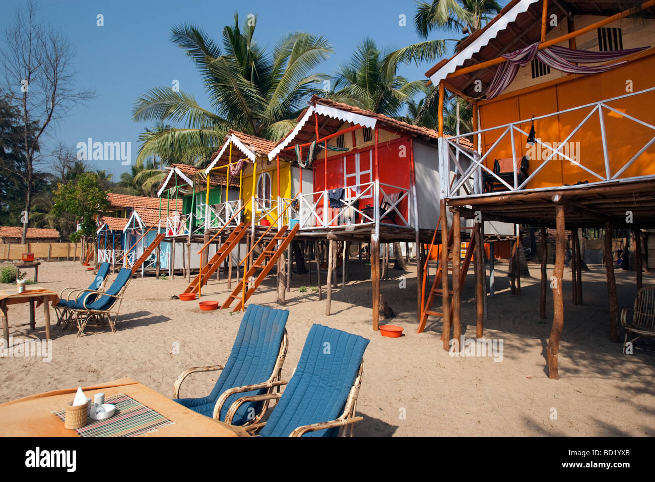 Cocohuts beach holiday bungalows on stilts Agonda beach Goa India Stock Photo