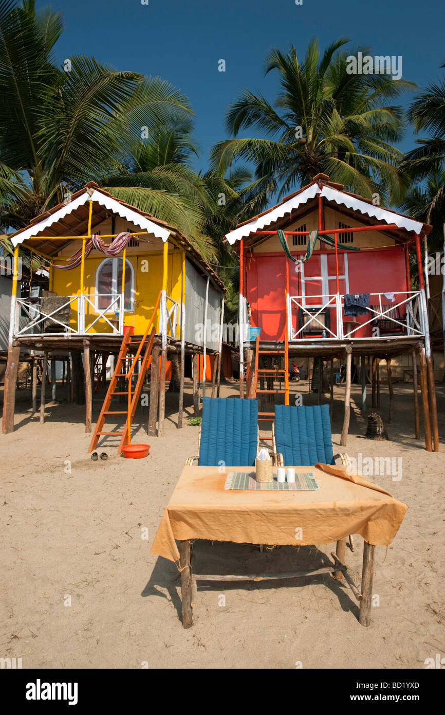 Cocohuts beach holiday bungalows on stilts Agonda beach Goa India Stock Photo