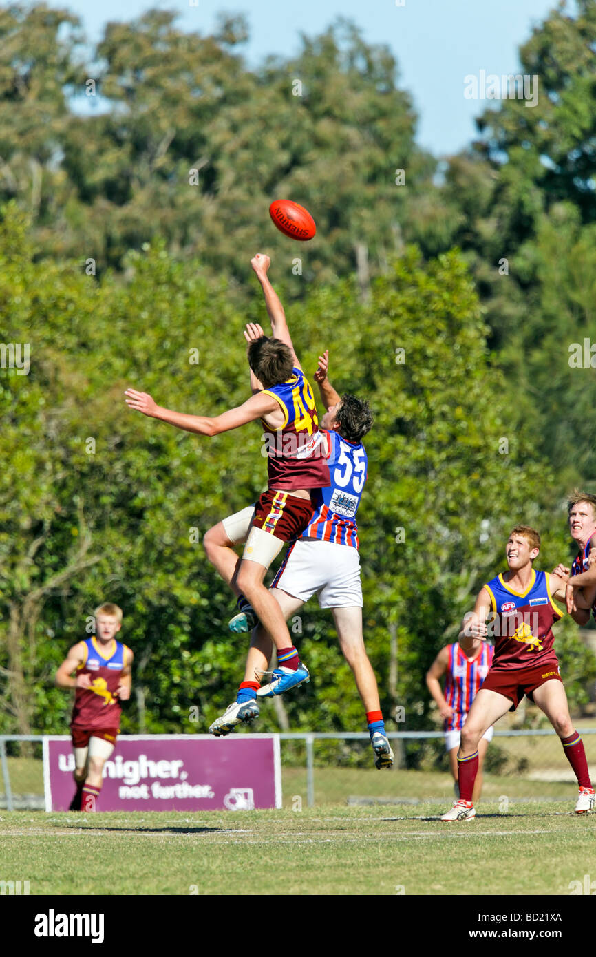 Australian Rules Football being played by two teams in a competition