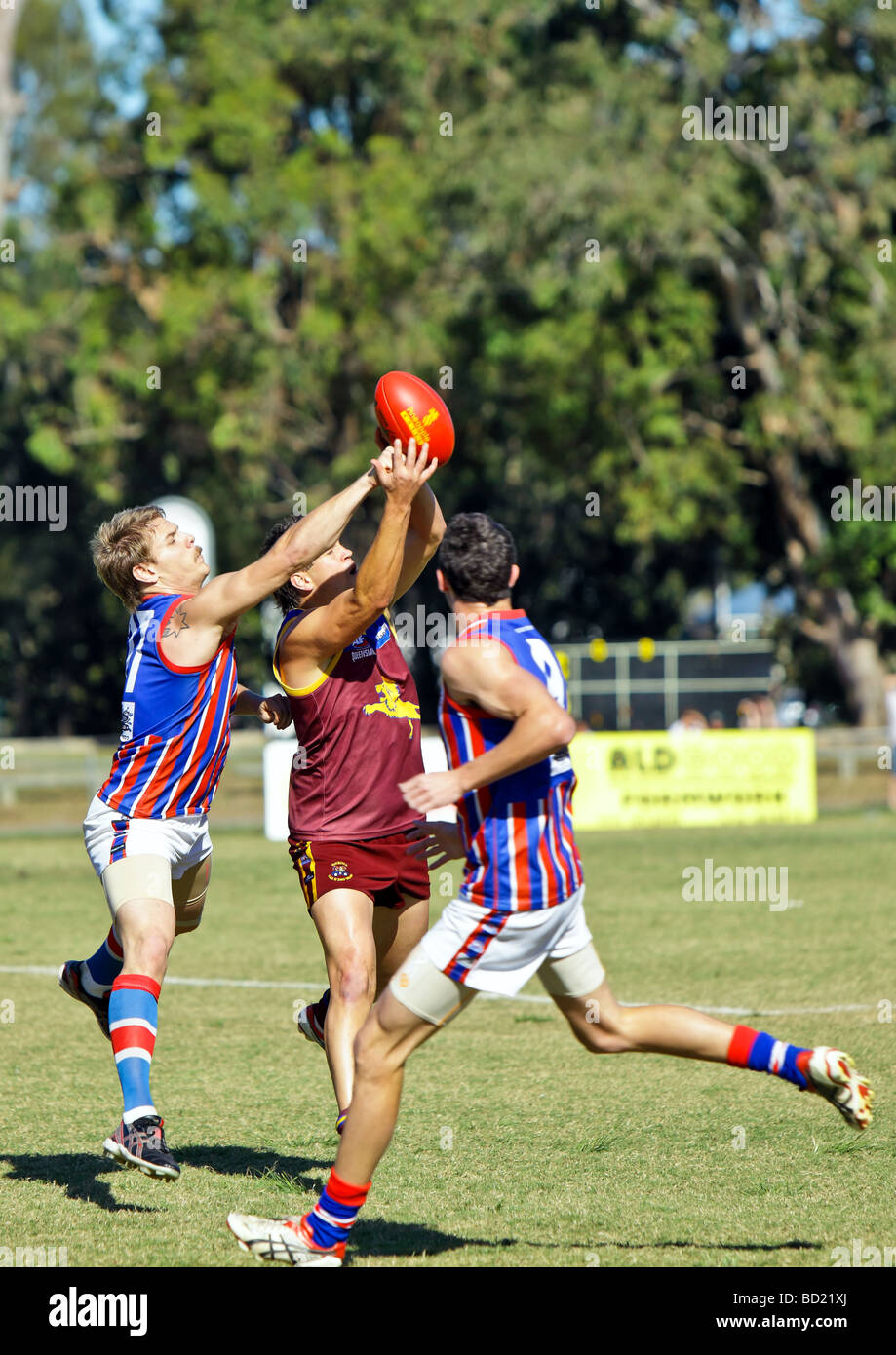 Australian Rules Football being played by two teams in a competition