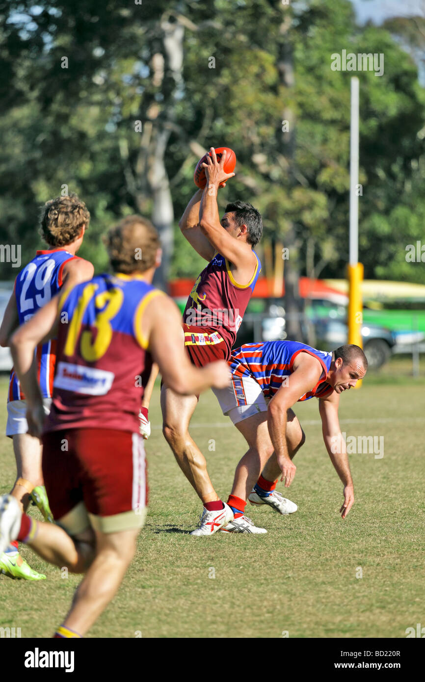 Australian Rules Football being played by two teams in a competition Stock Photo