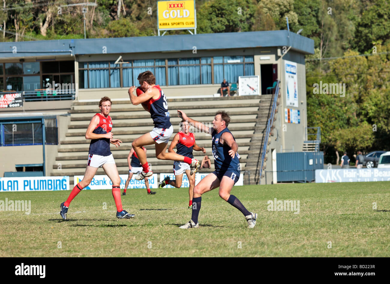 Australian Rules Football being played by two teams in a competition