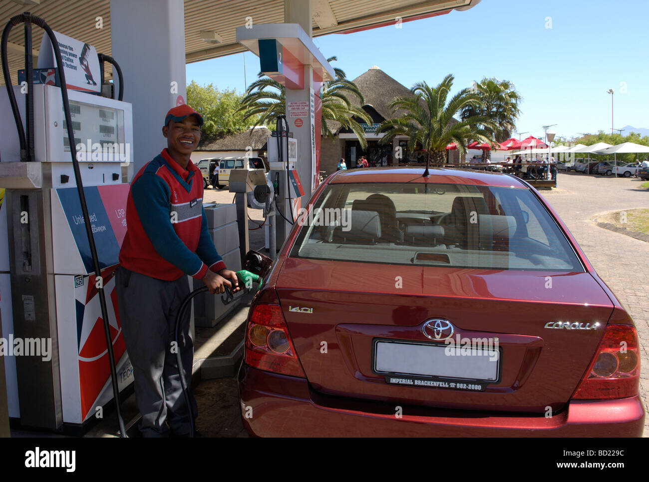 Garage attendant filling car with petrol, N2,Riversonderend, Overberg ...