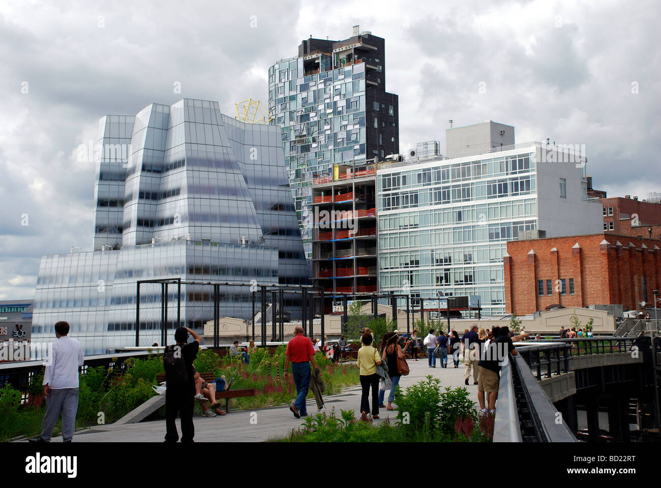 View of architecture from park that was once abandoned High Line rail service to historic warehouse district in New York City Stock Photo
