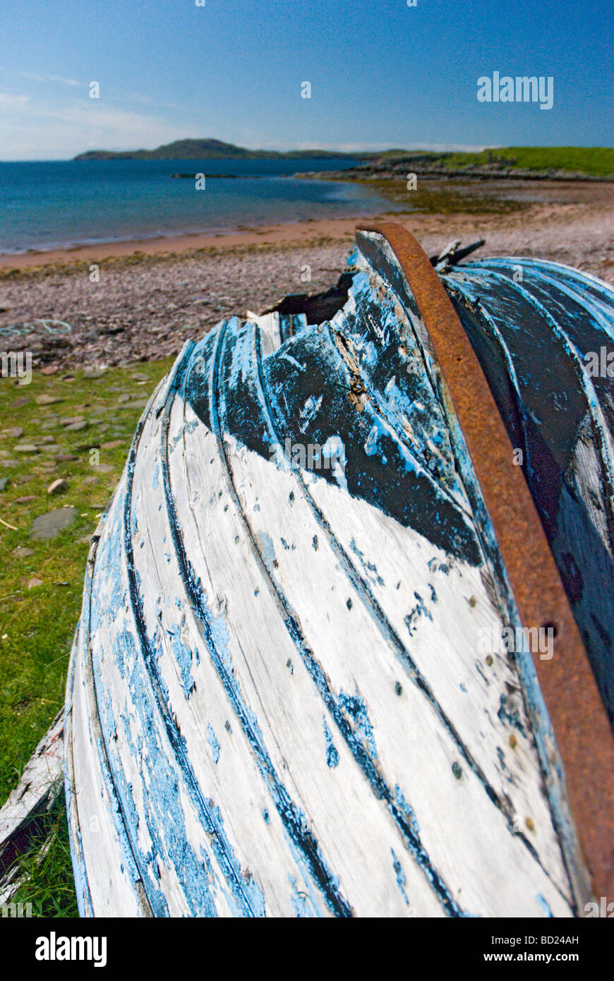 An upturned boat on a Scottish shore Stock Photo