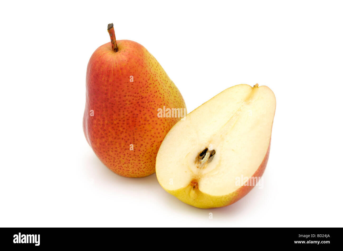 A Whole and Half a Forelle Pear Stock Photo