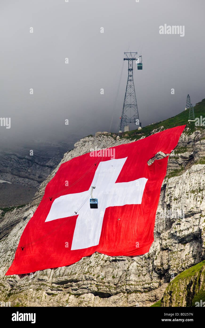 Largest swiss flag ever produced unrolled on the north cliff of the Säntis for the swiss national day, 01.08.2009, Schwägalp, CH Stock Photo