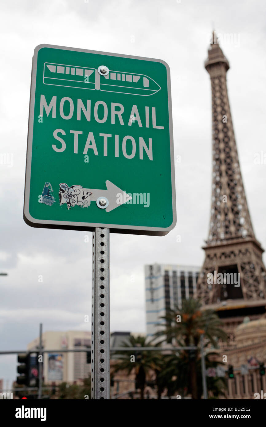 Sign for the Las Vegas monorail with the Eiffel Tower of Paris hotel in the background. Stock Photo