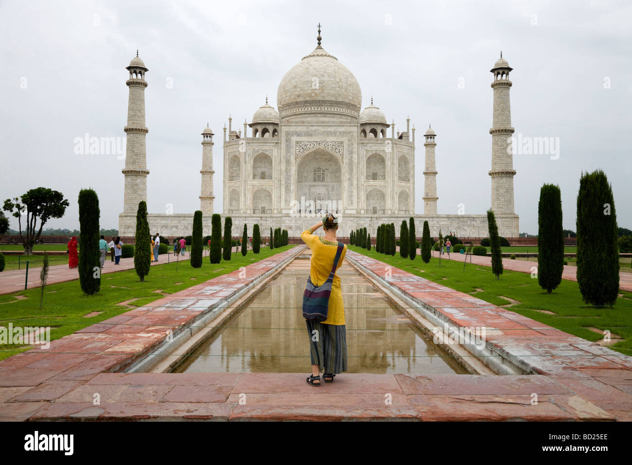 Woman tourist takes a photo of the Taj Mahal mausoleum, Agra. India. Stock Photo