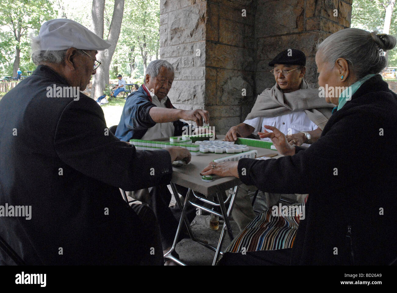Canadians from Tibetan playing board game in Montreal Stock Photo