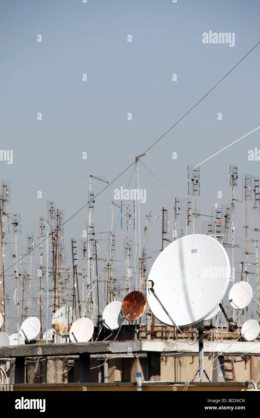 many tv aerials and satellite dishes on rooftops Stock Photo Alamy