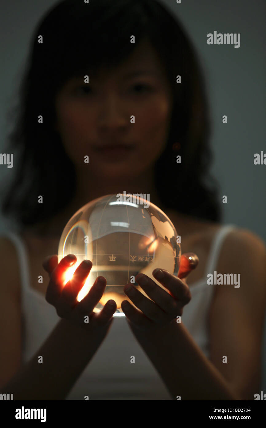 Chinese girl holding crystal ball,China Stock Photo Alamy