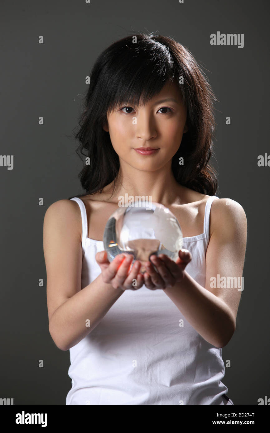 Chinese girl holding crystal ball,China Stock Photo Alamy