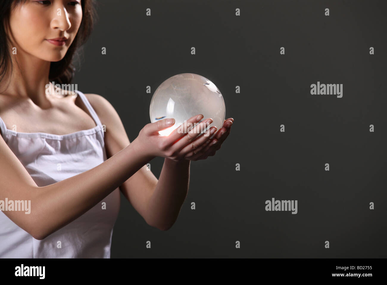 Chinese girl holding crystal ball,China Stock Photo Alamy