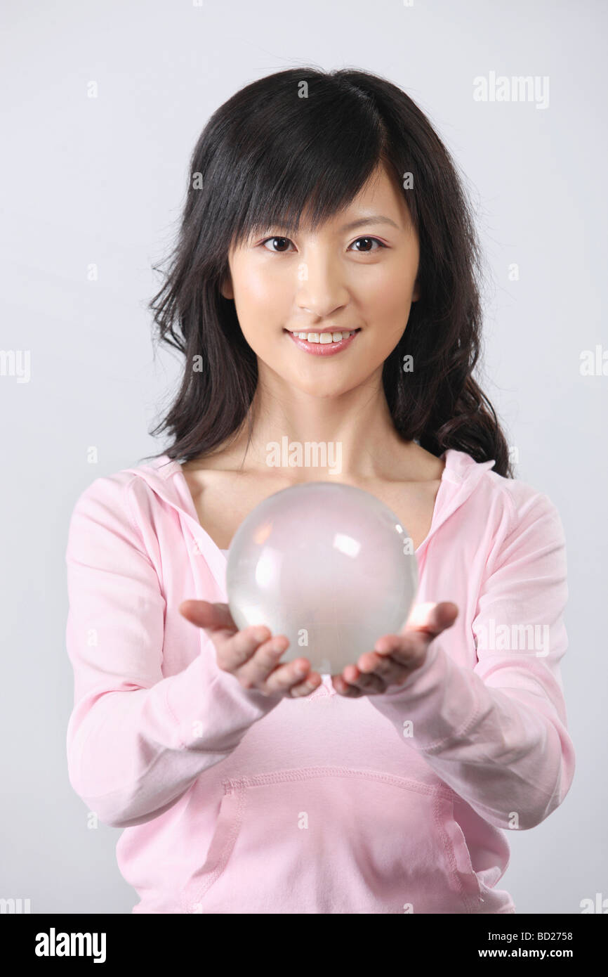 Chinese girl holding crystal ball,China Stock Photo Alamy