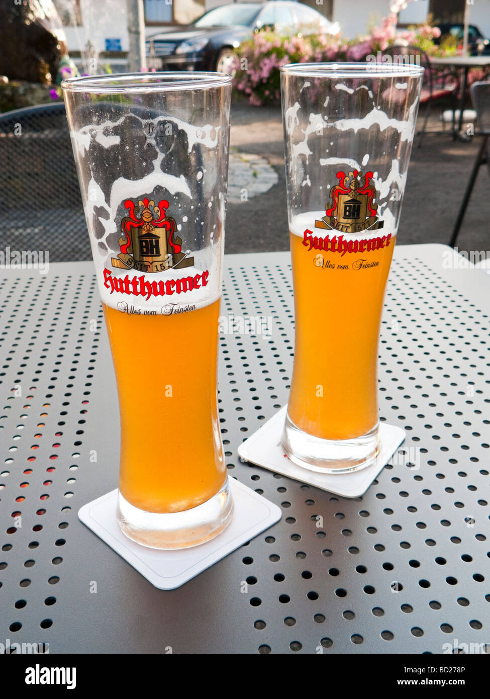 German beer, Weissbier, in traditional tall glasses on table in beer  garden, Germany Stock Photo - Alamy