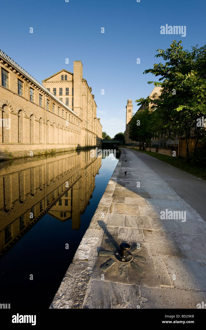 A view of Salts Mill and the Leeds Liverpool Canal at Saltaire, a UNESCO world heritage site in Bradford West Yorkshire Stock Photo