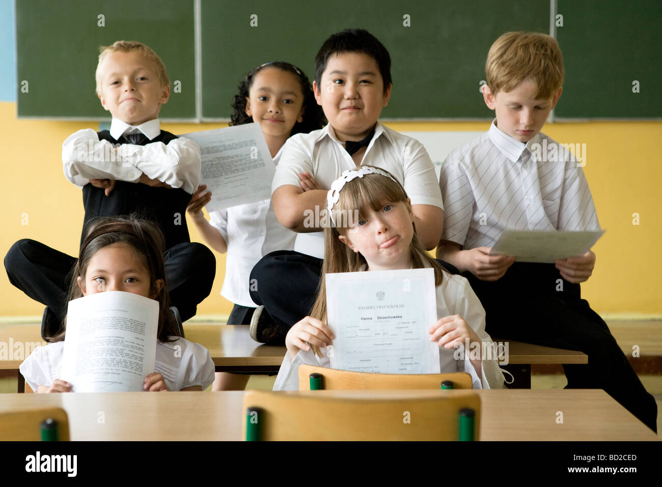 Children with school reports Stock Photo
