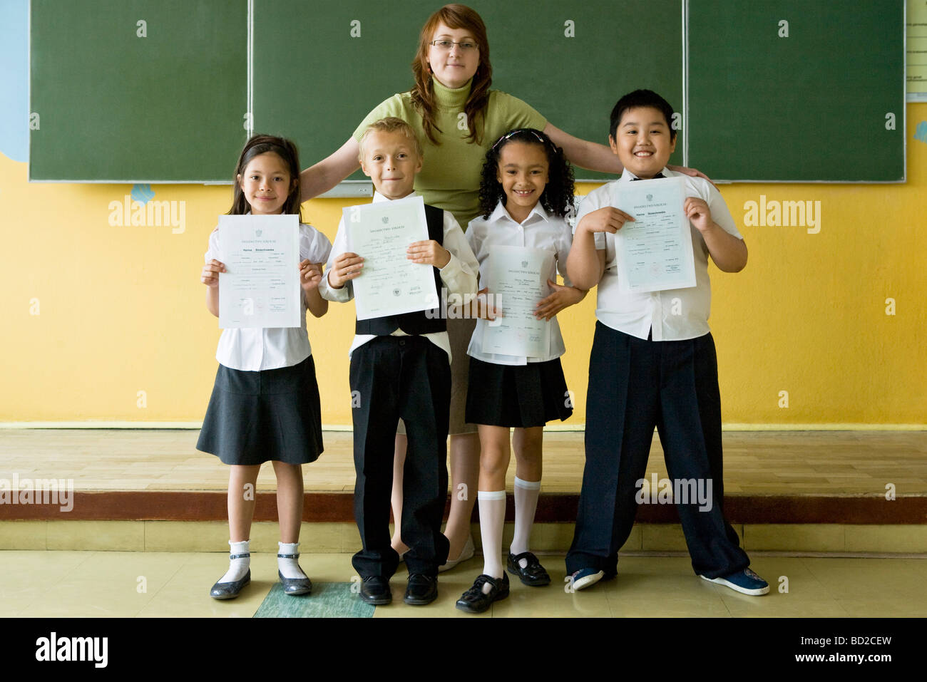 Kids with school reports Stock Photo