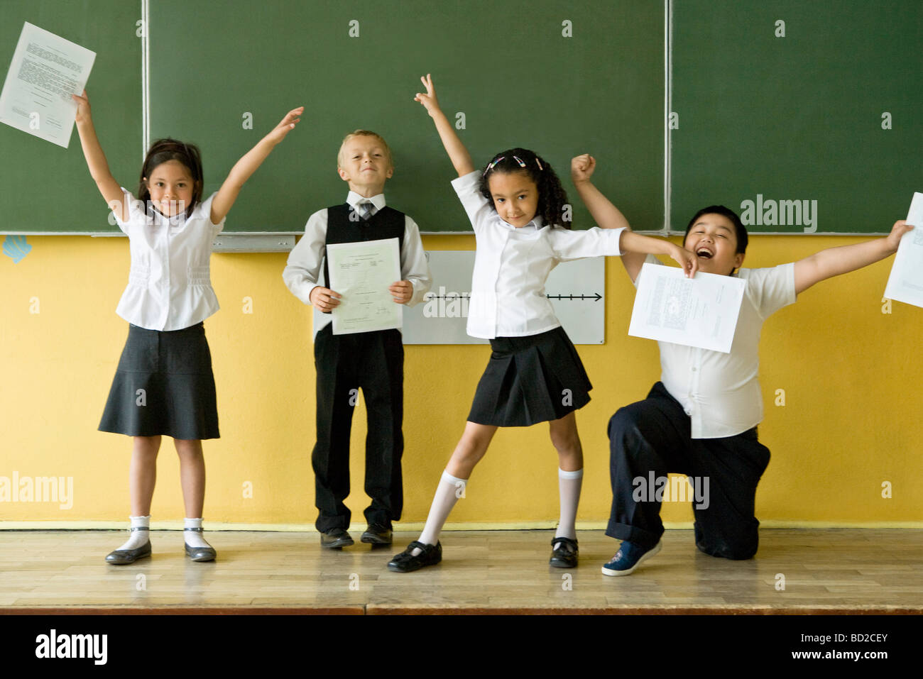 Kids with school reports Stock Photo