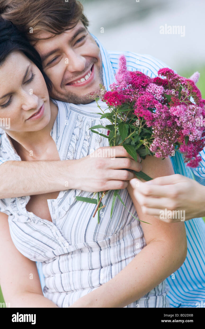 Loving couple with flowers Stock Photo - Alamy