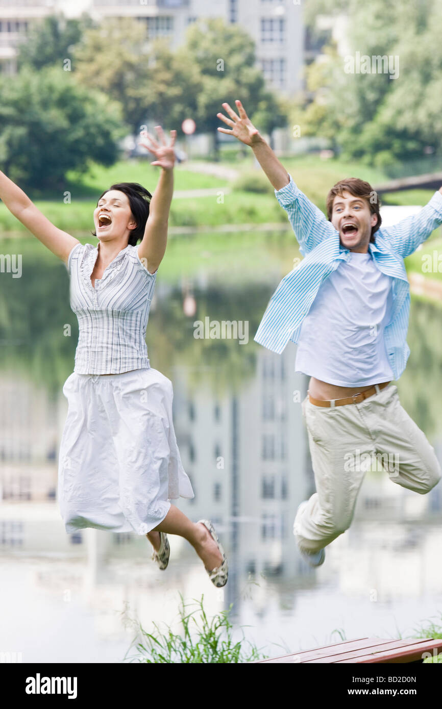 Crazy couple jumping Stock Photo Alamy