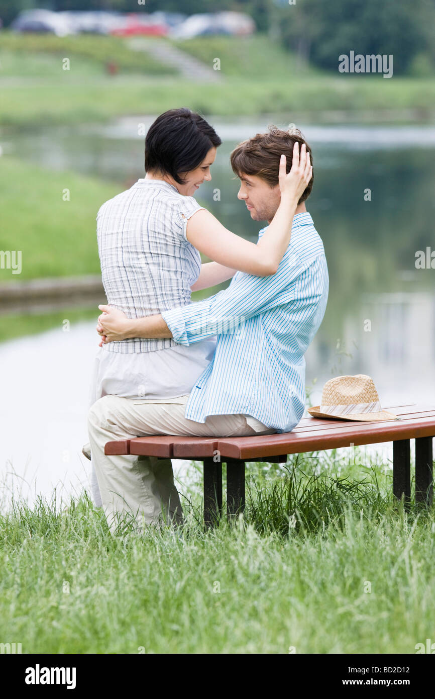 Couple hugging in park Stock Photo - Alamy