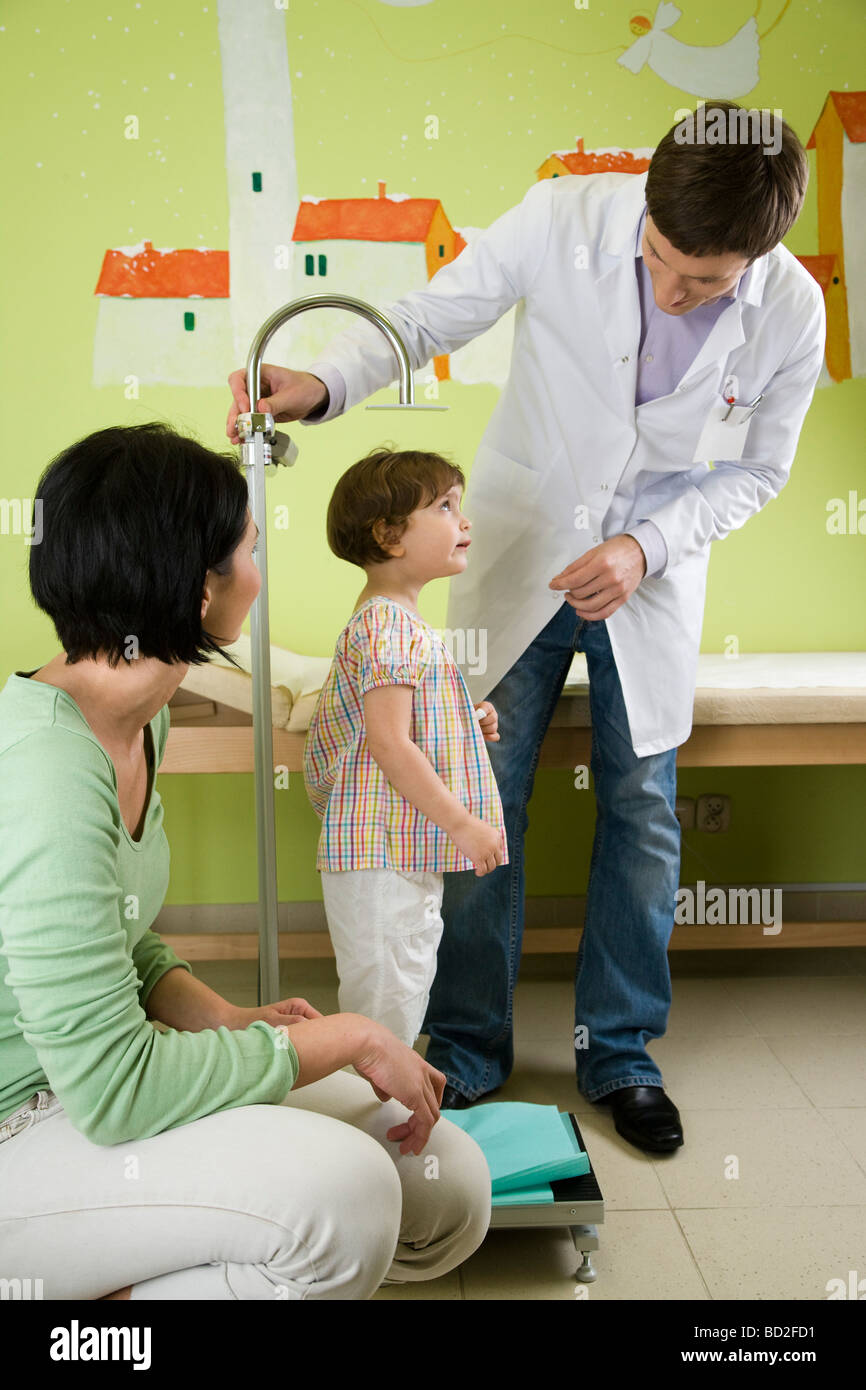doctor measuring height of child Stock Photo