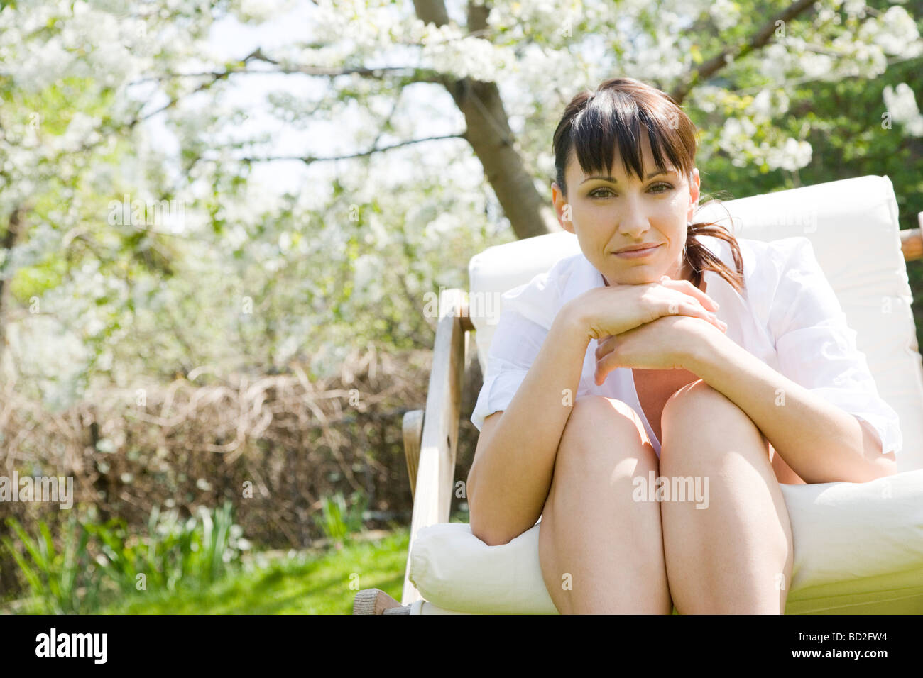mature woman relaxing in garden Stock Photo - Alamy