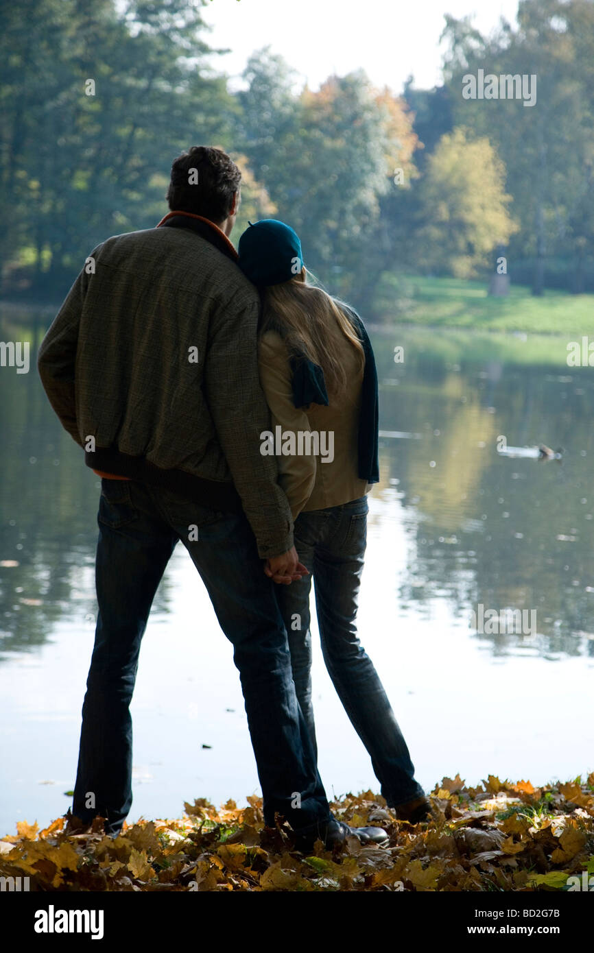 Couple hugging in park Stock Photo - Alamy