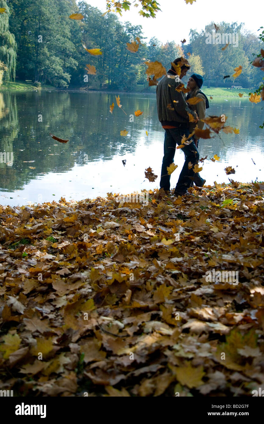 Couple hugging in park Stock Photo - Alamy