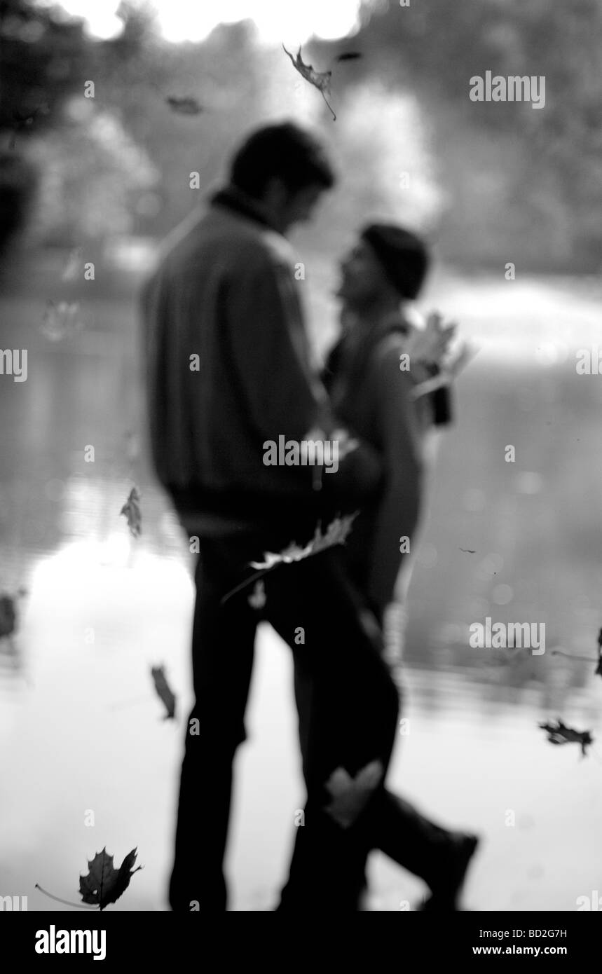 Couple hugging in park Stock Photo - Alamy